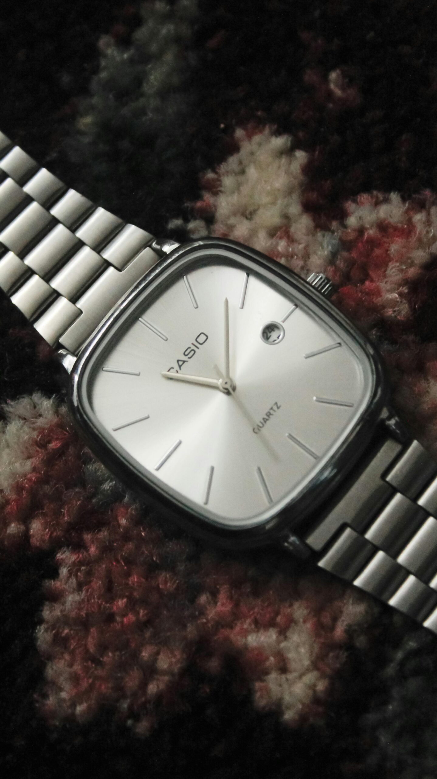 Sleek Casio wristwatch with a stainless steel band and white dial.